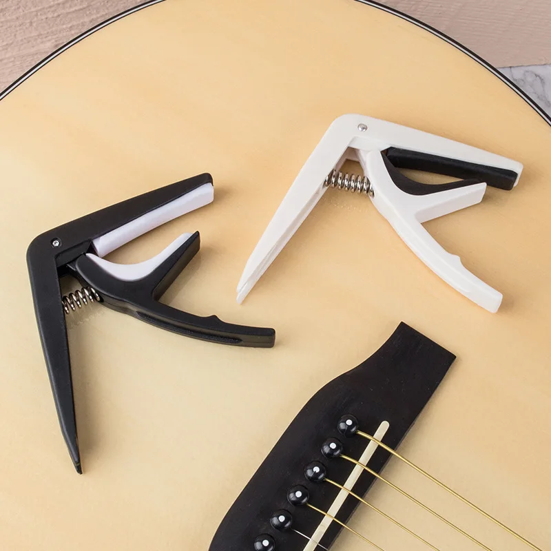 Универсальный гитарный каподас – обзор и цена Guitar Capo Clip